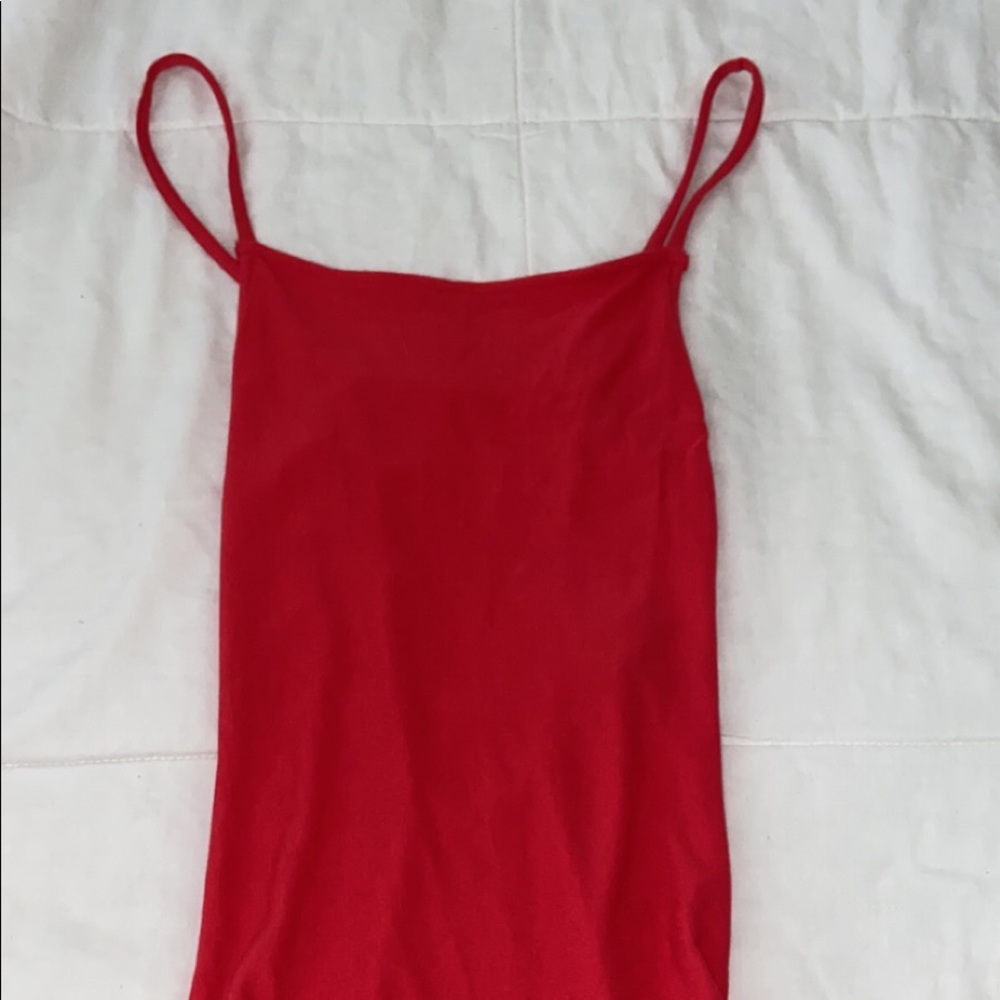 Hot pink bodysuit, with cut out back.